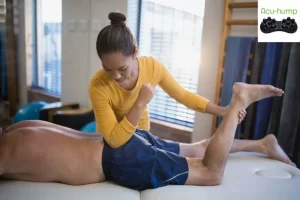 Piriformis syndrome relief Lying on a massage table, the therapist uses elbows to deeply press buttocks to release tight muscles and relieve sciatica